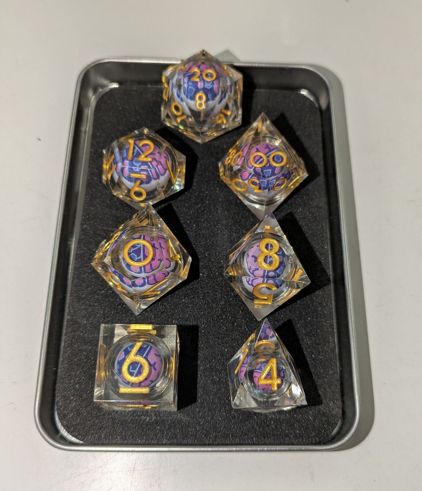 Sharp Edge Moving RPG Dice Set - Foam Brain Logo